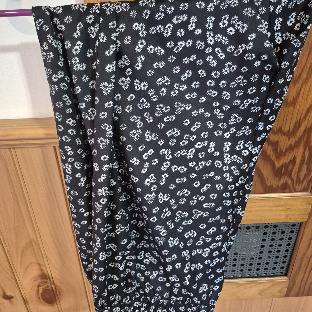 Chic Black Pants with White Floral Pattern